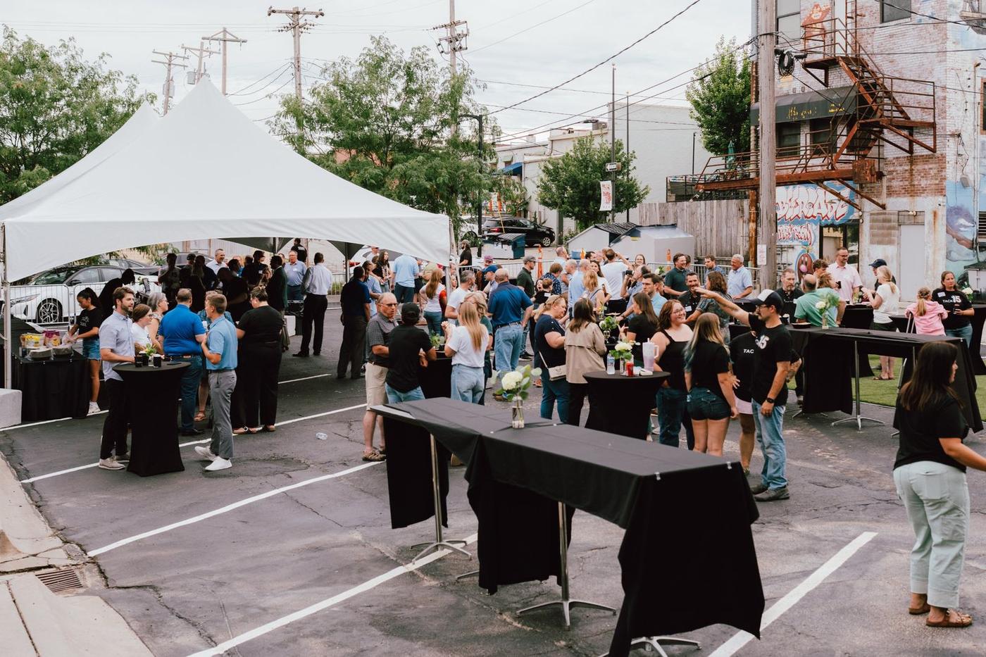 Guests gathered outside at TACK Architects' 15th anniversary party